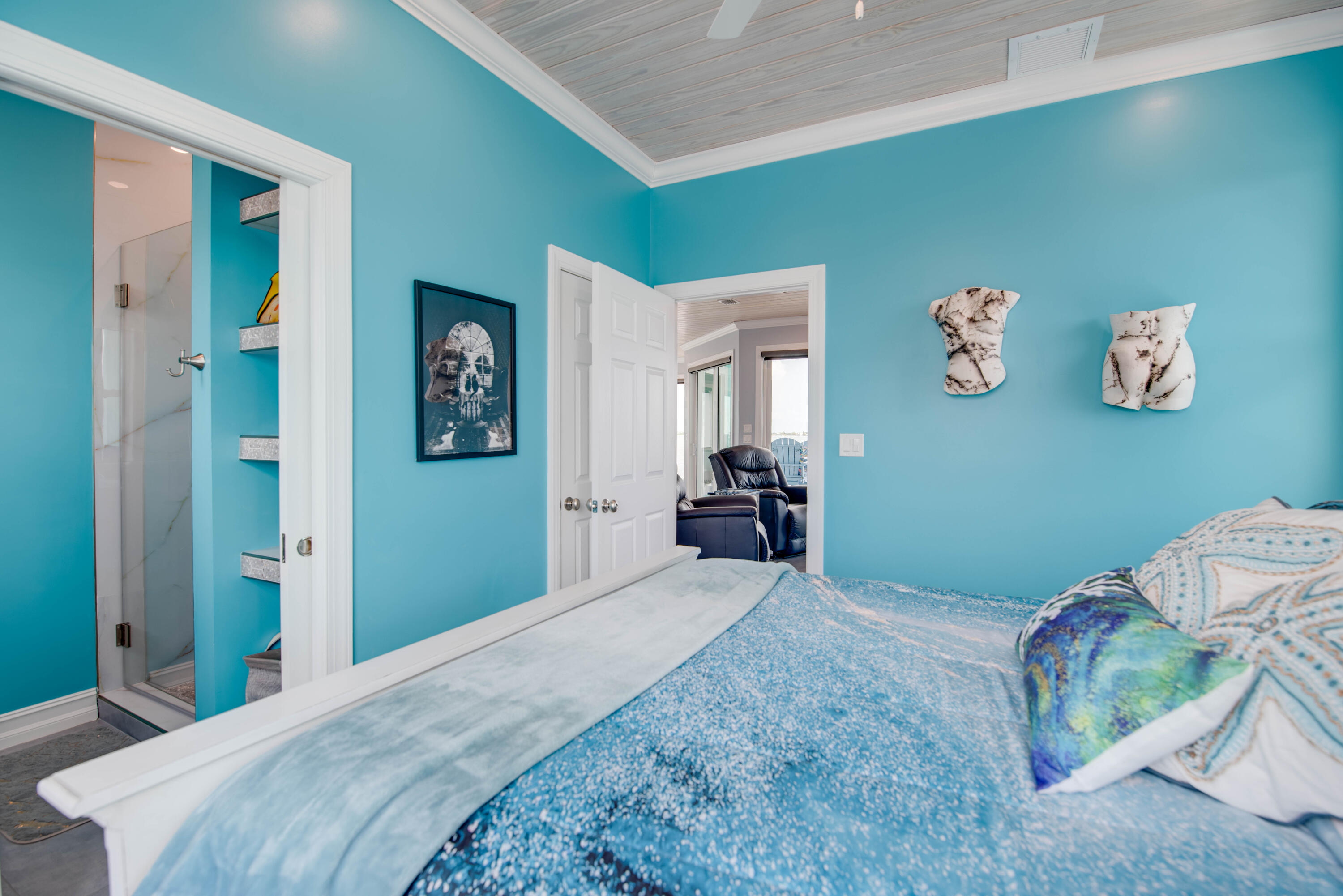 747 La Fitte Road Summerland Key, FL 33042 - Photo 92 of 103 a bedroom with a bed and cabinets