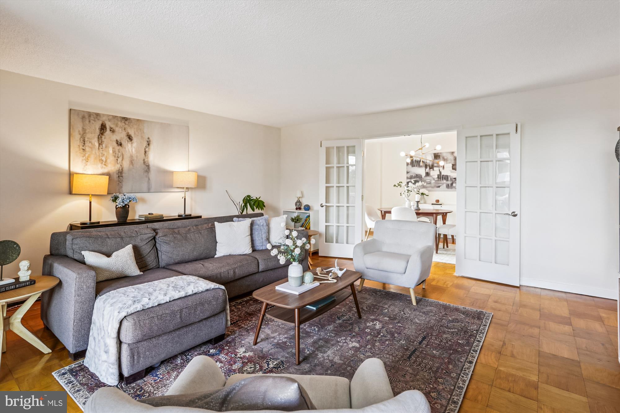 300 M Street Southwest, Unit N400 Washington, DC 20024 - Photo 2 of 29 a living room with furniture and a wooden floor