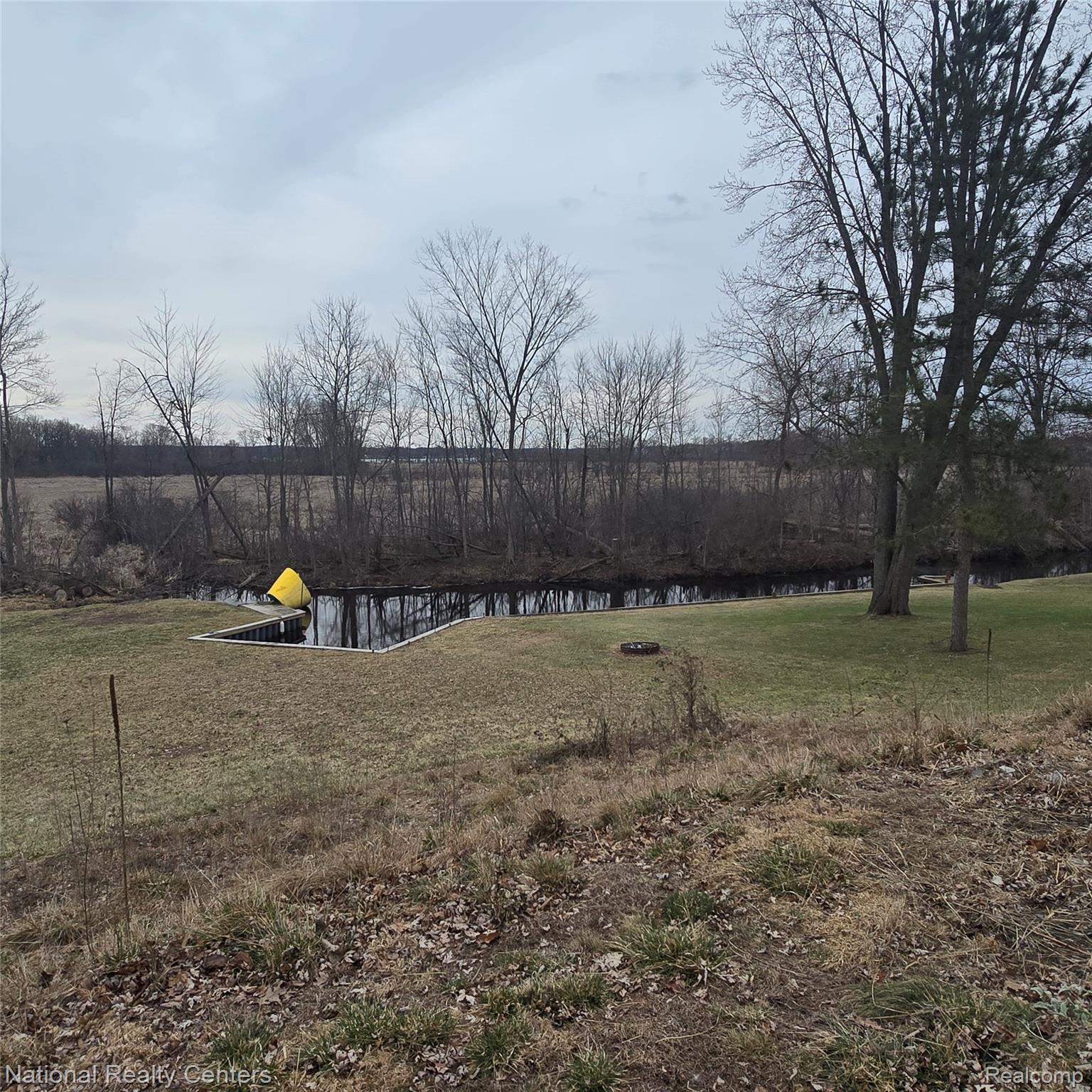 13477 South Horrell Road Fenton, MI 48430 - Photo 24 of 30 View of grassy yard with a water view
