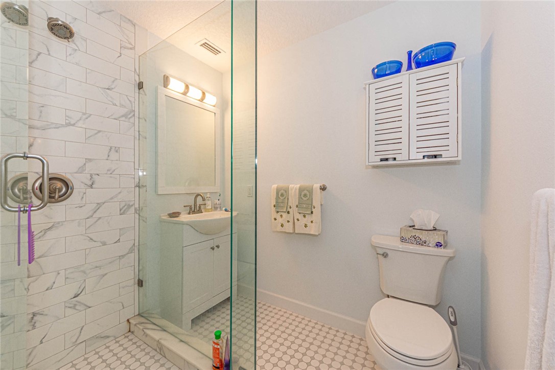 2800 Indian River Boulevard, Unit G6 Vero Beach, FL 32960 - Photo 12 of 22 a bathroom with a toilet and a shower