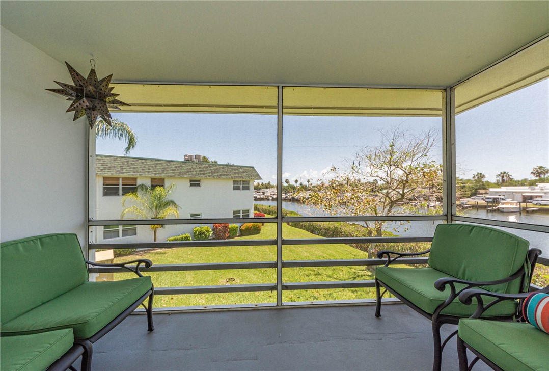 2800 Indian River Boulevard, Unit G6 Vero Beach, FL 32960 - Photo 14 of 22 a bedroom with furniture and a window