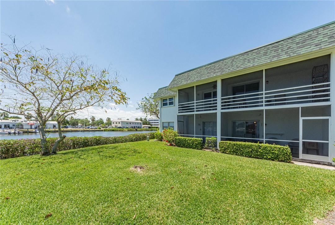 2800 Indian River Boulevard, Unit G6 Vero Beach, FL 32960 - Photo 19 of 22 a view of an house with backyard space and garden