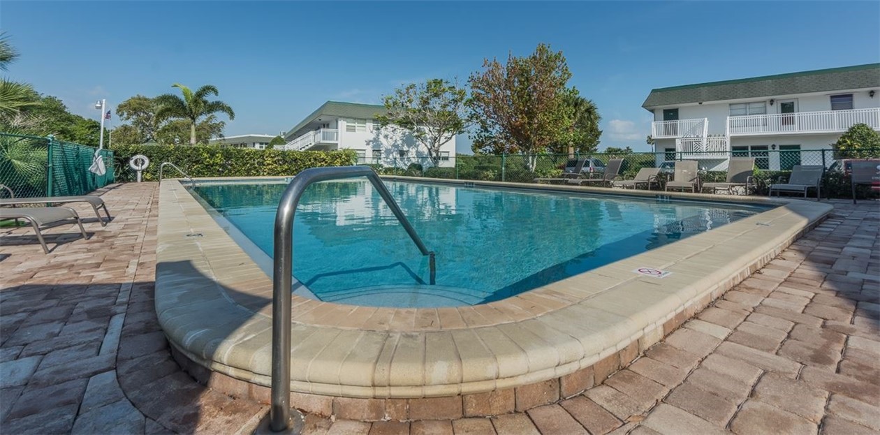 2800 Indian River Boulevard, Unit G6 Vero Beach, FL 32960 - Photo 22 of 22 a view of a swimming pool with a porch