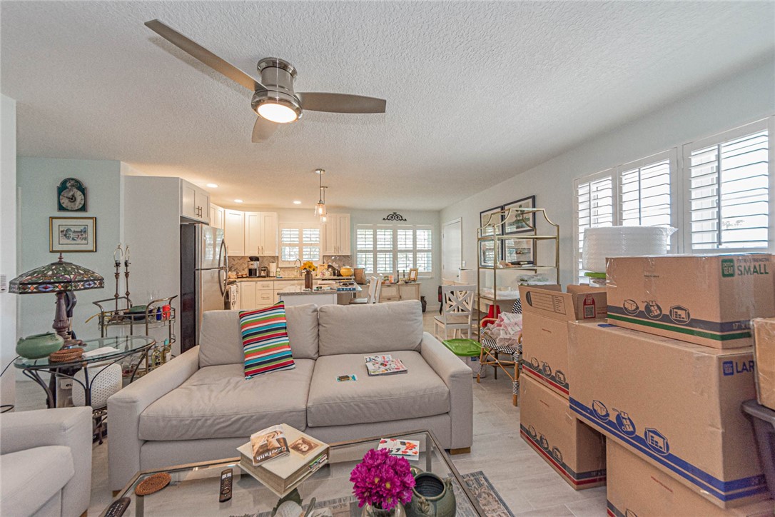 2800 Indian River Boulevard, Unit G6 Vero Beach, FL 32960 - Photo 5 of 22 a living room with furniture and a view of kitchen