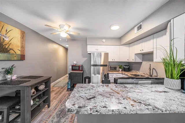 a kitchen with granite countertop lots of counter top space