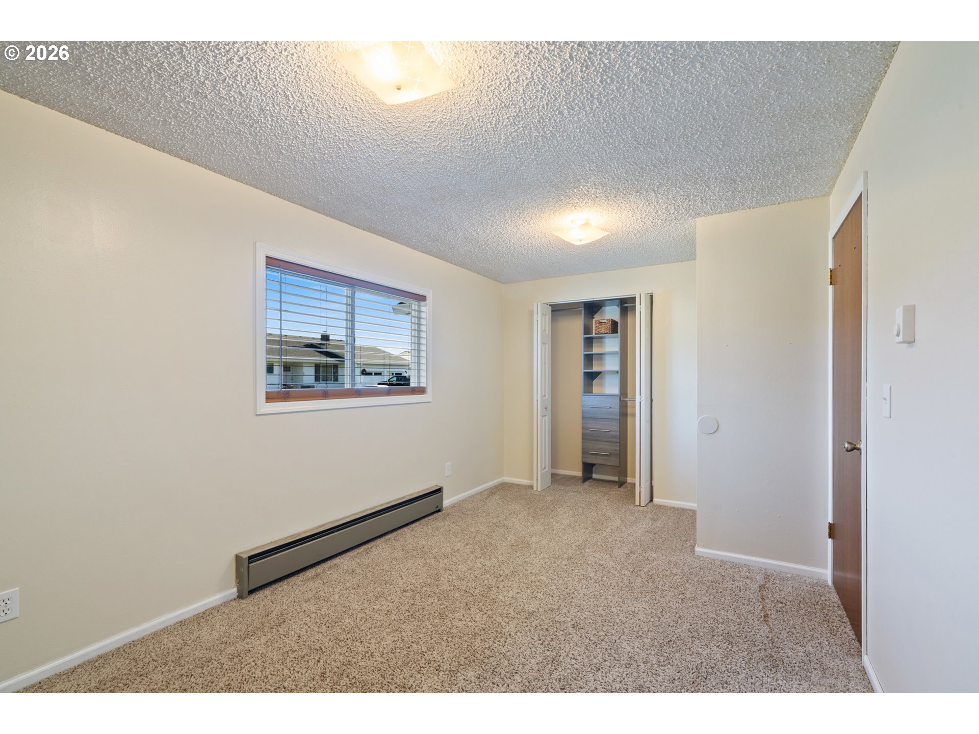 702 Ash Avenue Tillamook, OR 97141 - Photo 21 of 27 view of an empty room with window