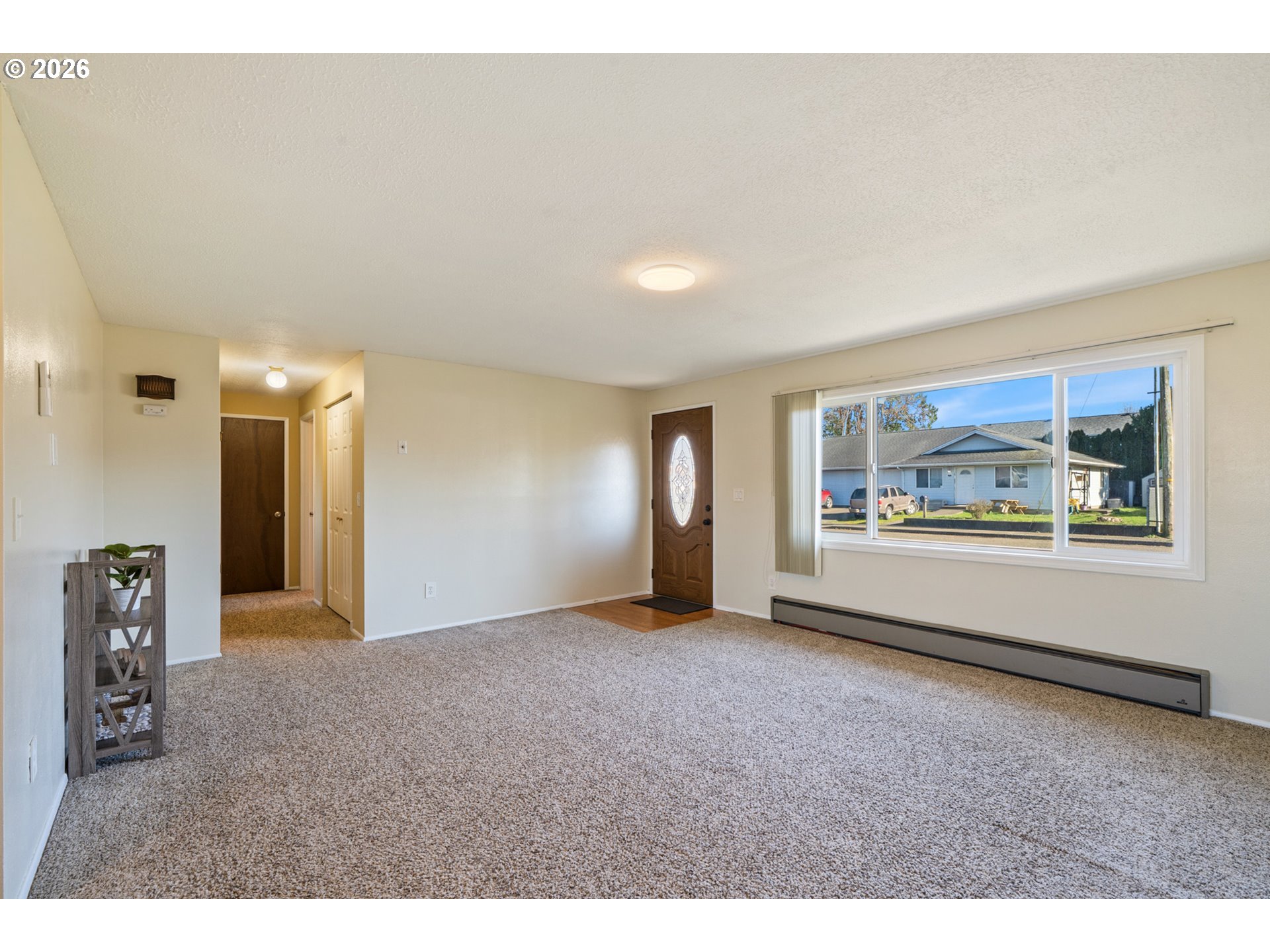 702 Ash Avenue Tillamook, OR 97141 - Photo 8 of 27 a view of an empty room with a window