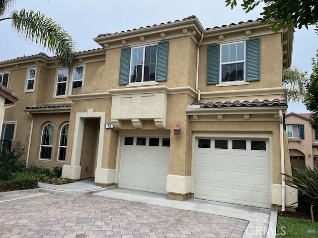 a view of a white house with large windows