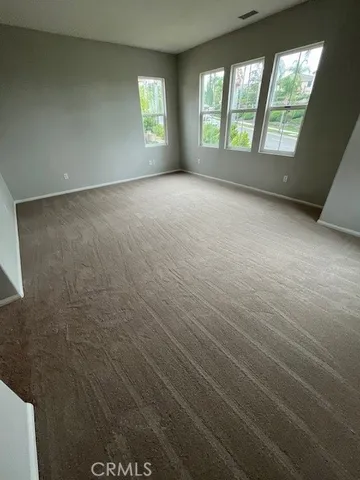 a view of house with a tree in front