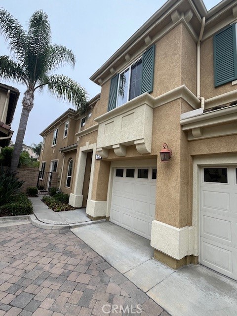 13 Yorkshire Court Laguna Niguel, CA 92677 - Photo 2 of 21 a view of a white house with many windows