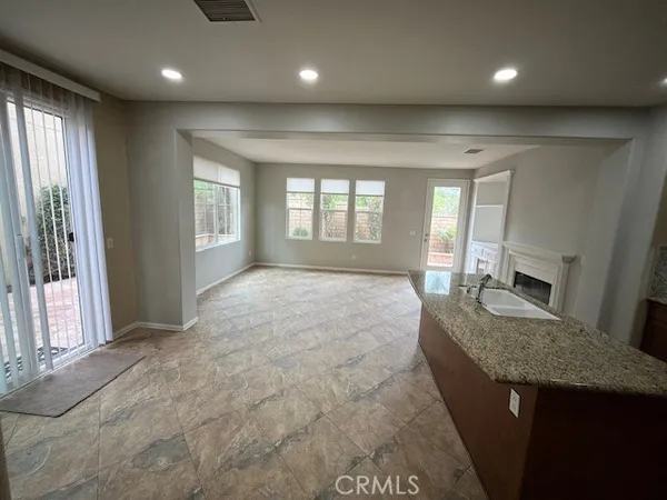 a view of a big room with windows