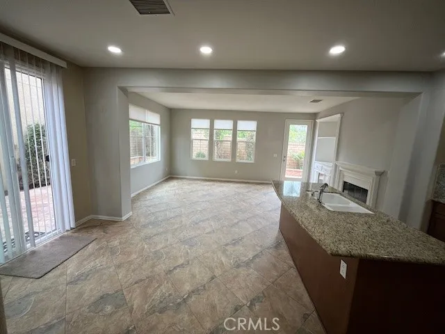 a view of a big room with windows