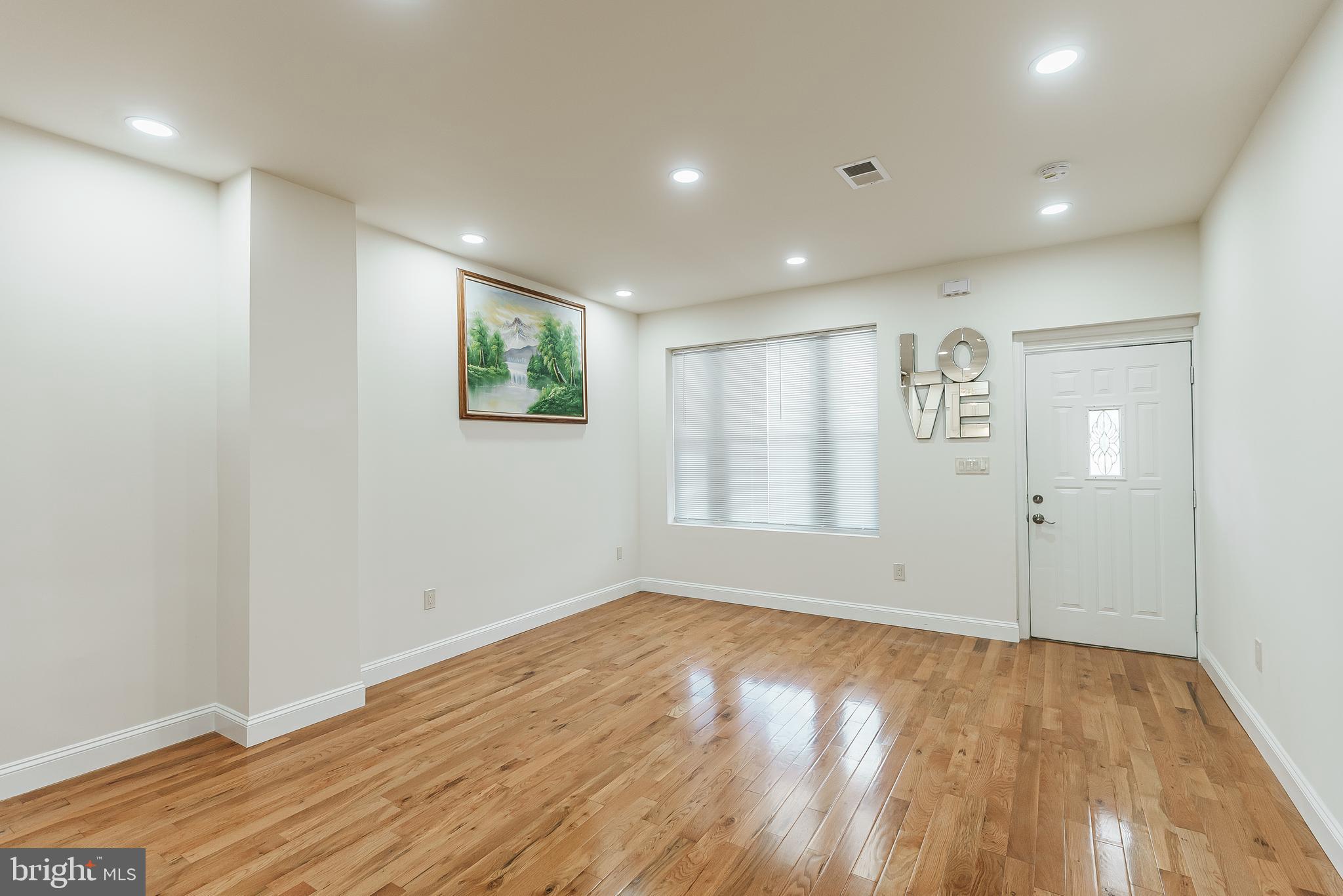6357 Old York Road Philadelphia, PA 19141 - Photo 16 of 41 a view of empty room with wooden floor and fan