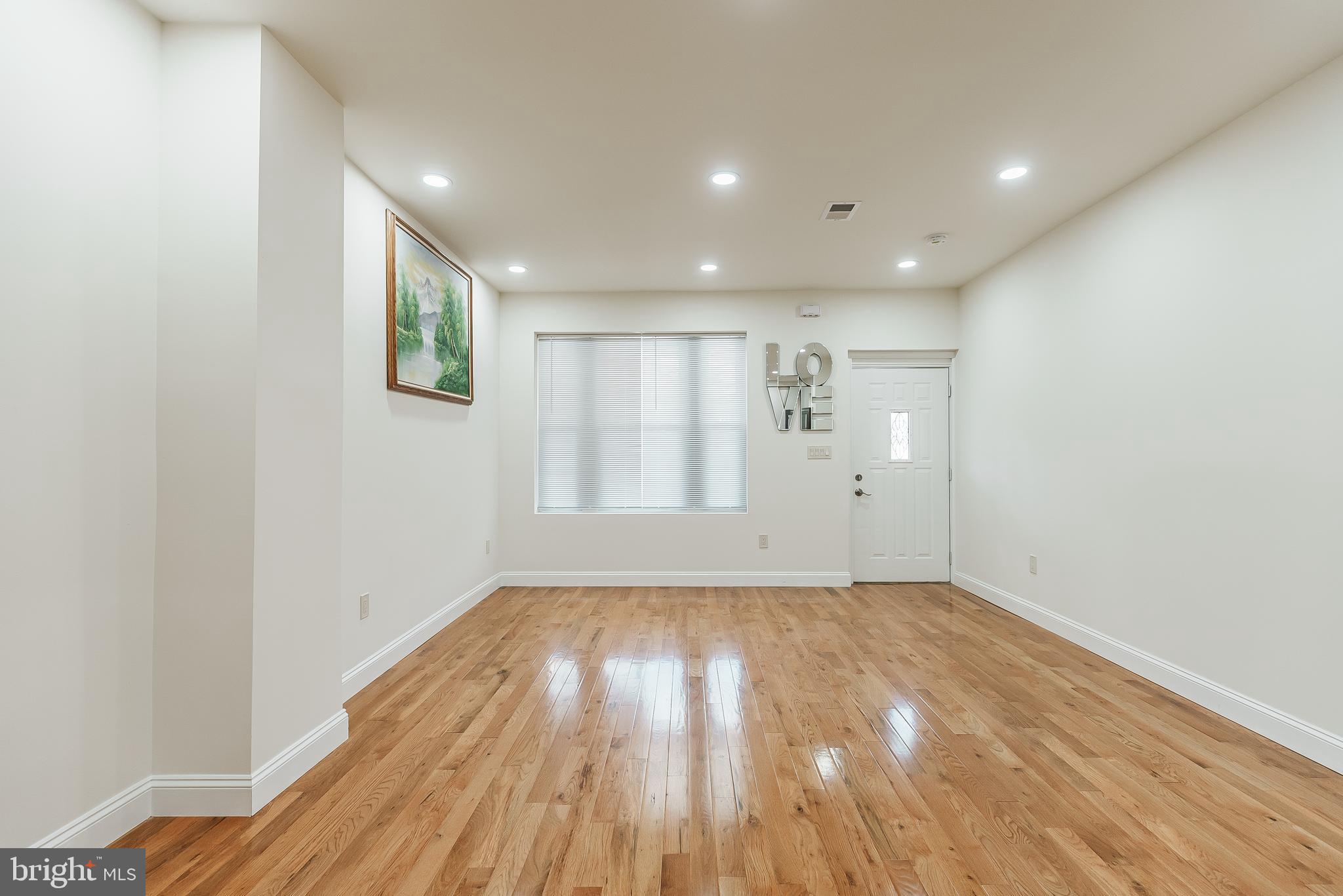 6357 Old York Road Philadelphia, PA 19141 - Photo 17 of 41 a view of empty room with wooden floor and fan