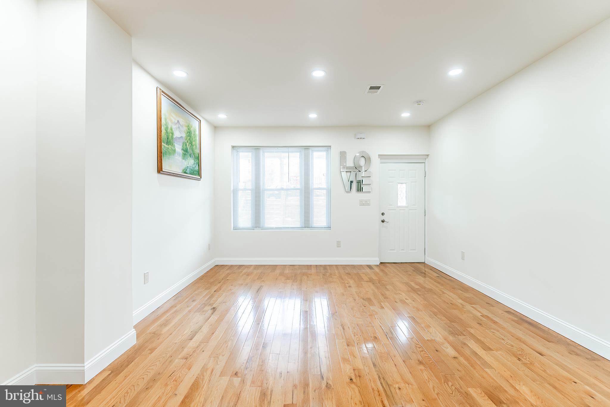 6357 Old York Road Philadelphia, PA 19141 - Photo 18 of 41 a view of empty room with wooden floor and fan