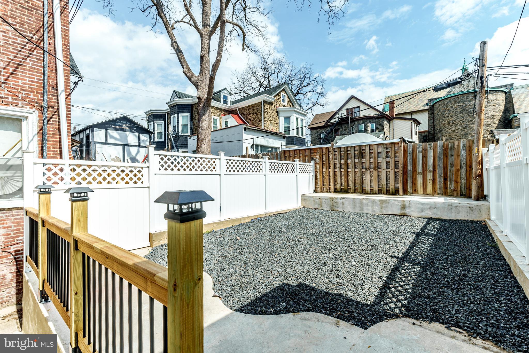 6357 Old York Road Philadelphia, PA 19141 - Photo 32 of 41 a front view of a house with parking