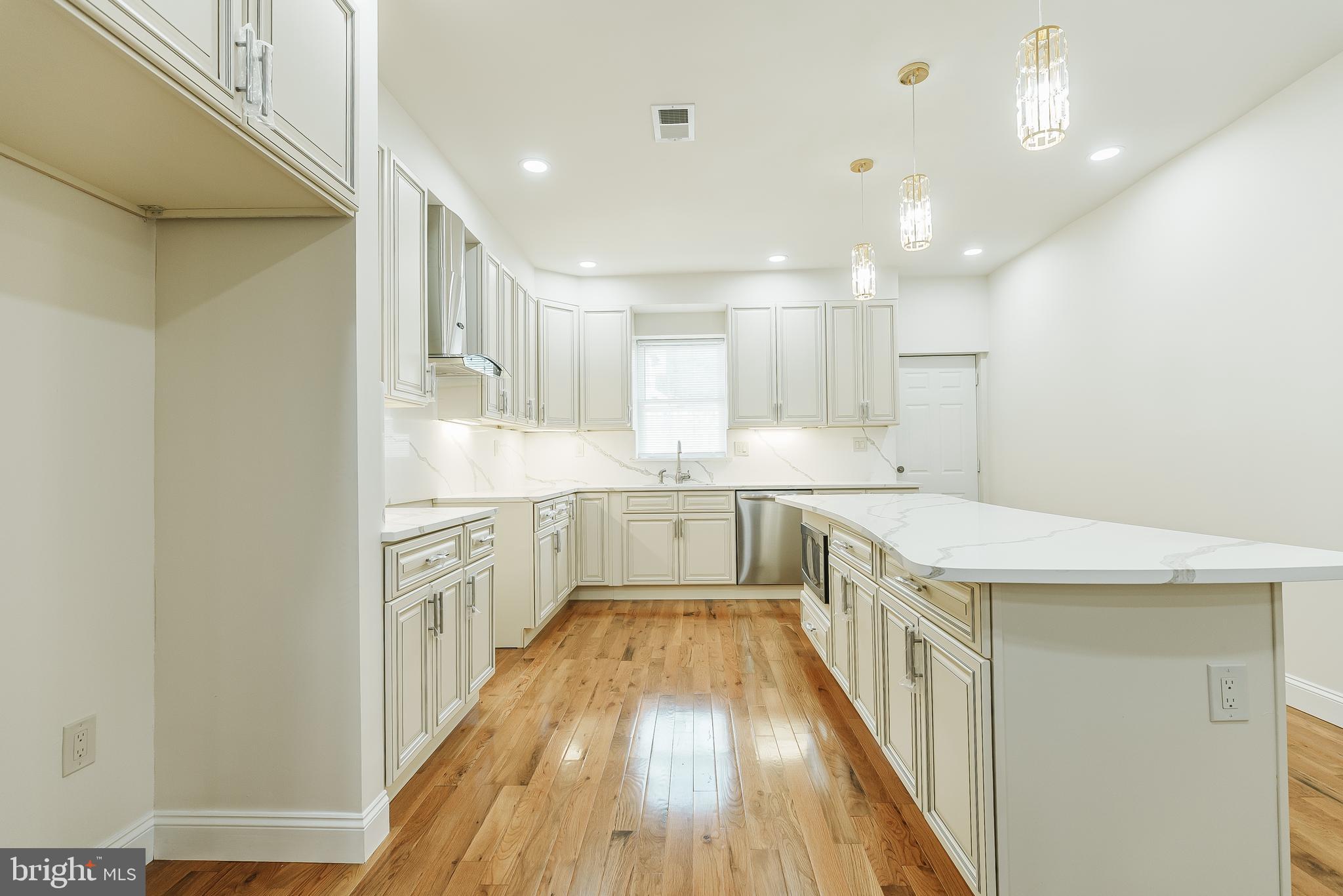 6357 Old York Road Philadelphia, PA 19141 - Photo 6 of 41 a view of a kitchen with a sink and wooden floor