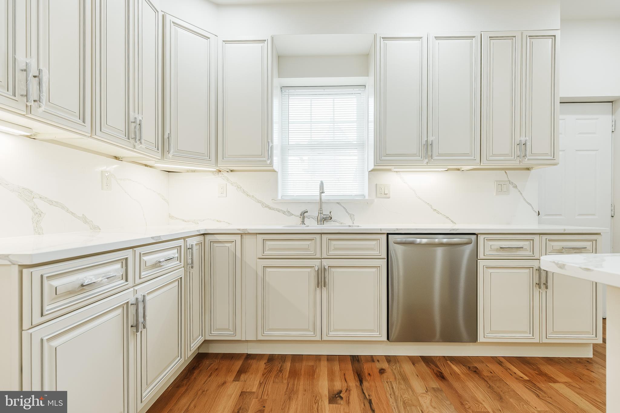 6357 Old York Road Philadelphia, PA 19141 - Photo 7 of 41 a kitchen with granite countertop white cabinets and sink