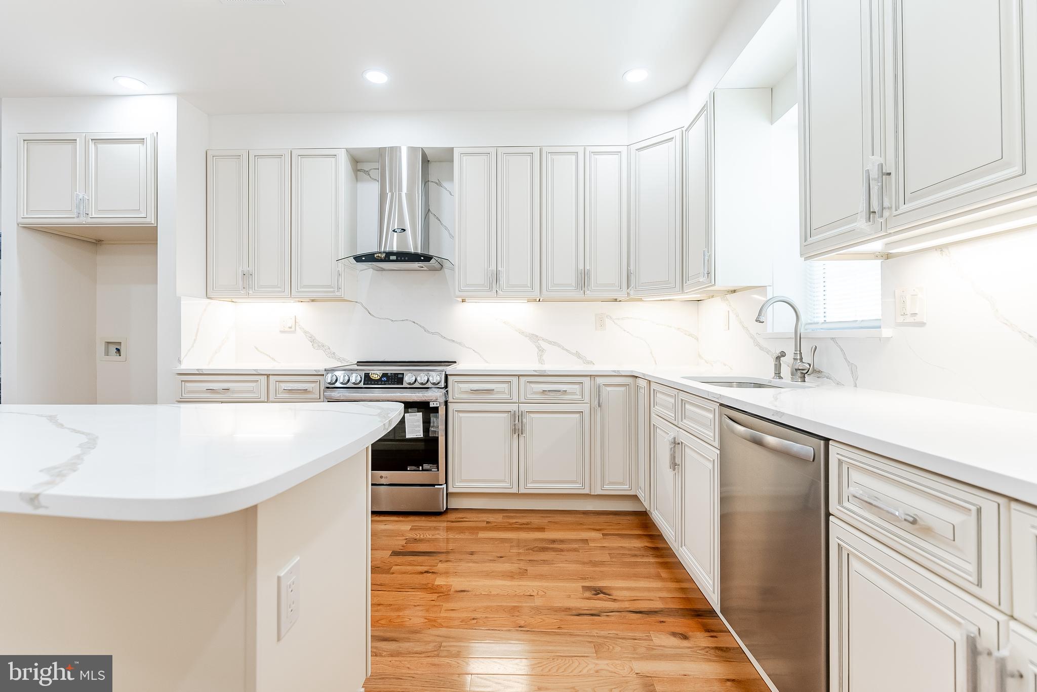 6357 Old York Road Philadelphia, PA 19141 - Photo 10 of 41 a kitchen with stainless steel appliances granite countertop a sink stove and refrigerator