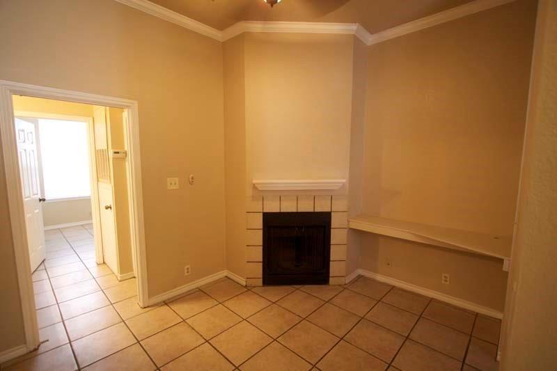 2814 Nueces Street, Unit 208 Austin, TX 78705 - Photo 3 of 6 a view of empty room with a fireplace