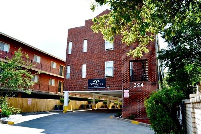 2814 Nueces Street, Unit 208 Austin, TX 78705 - Photo 6 of 6 a tall building with lots of trees in the background