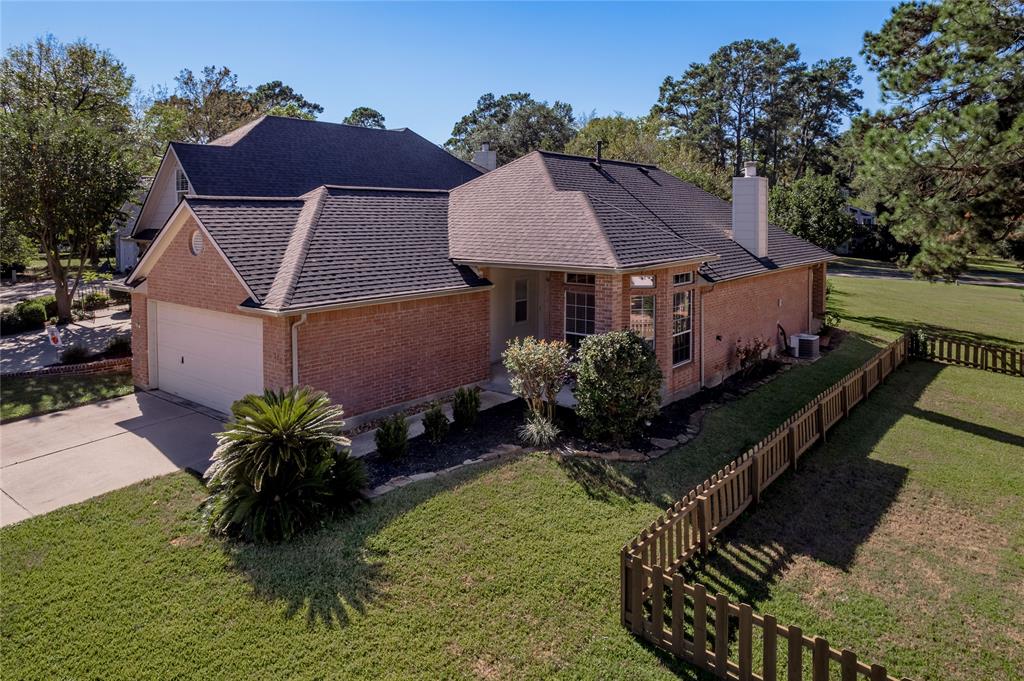 120 Fairway View Conroe, TX 77356 - Photo 1 of 19 a aerial view of a house with a yard