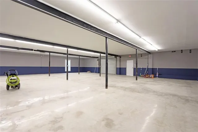 a view of kitchen with stainless steel appliances cabinets and outdoor view