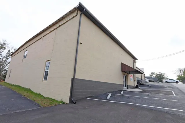a view of backyard with garage