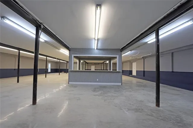 a view of an empty room with windows