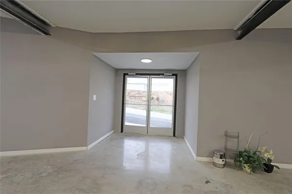 a view of an empty room and window