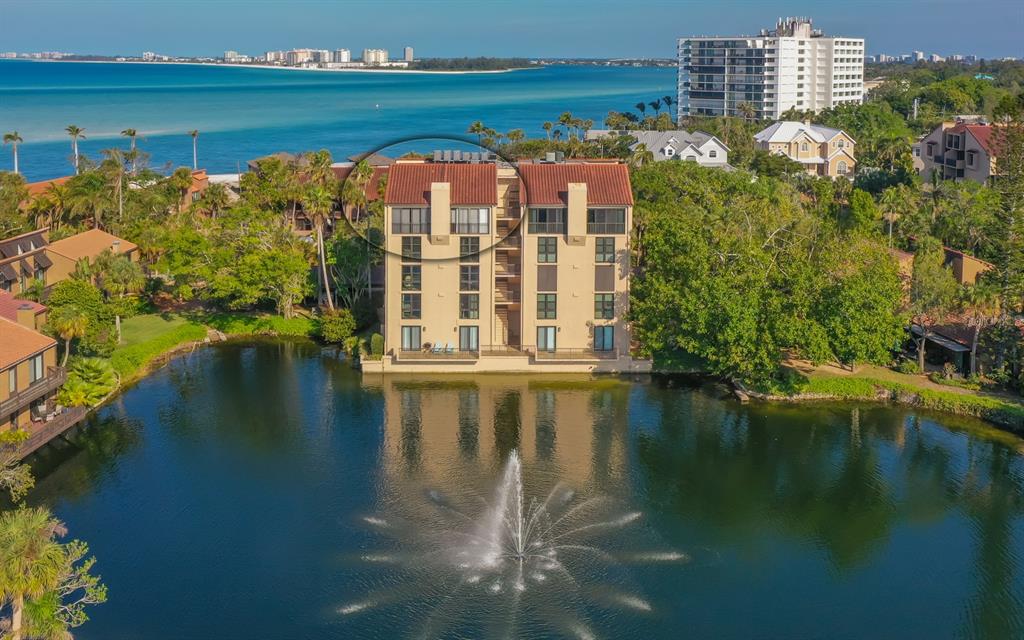 22 Sandy Cove Road, Unit 501 Sarasota, FL 34242 - Photo 1 of 1 a view of building with lake view
