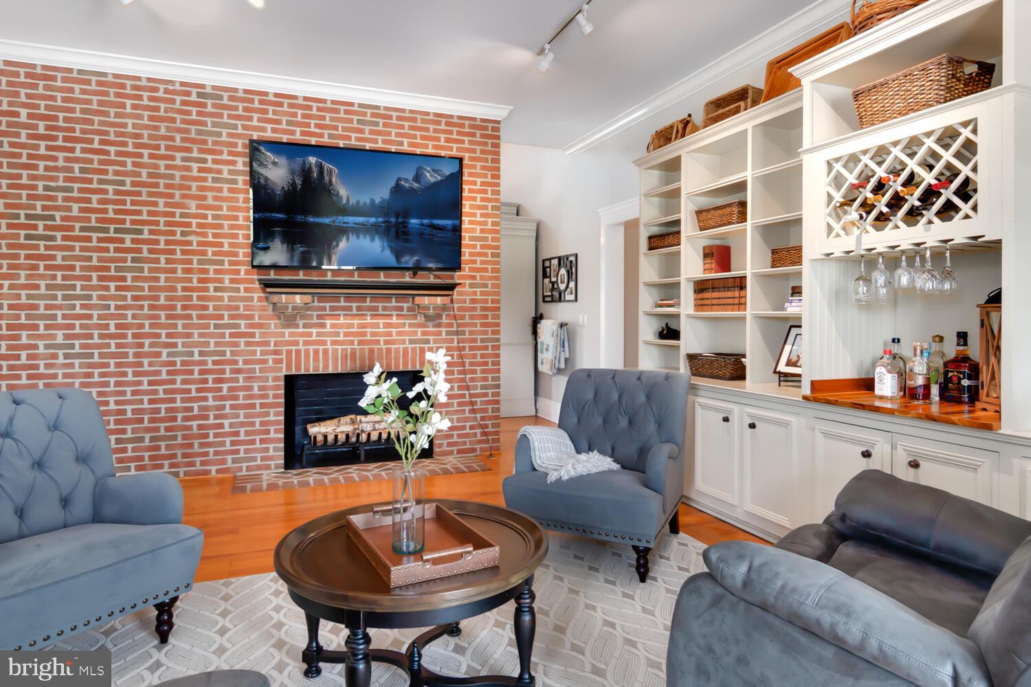 28589 Brick Row Drive Oxford, MD 21654 - Photo 26 of 129 Den with Wood burning fireplace