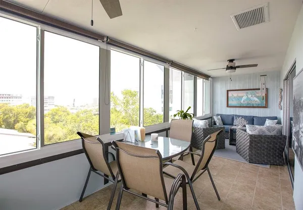 a dining room with furniture window and outside view