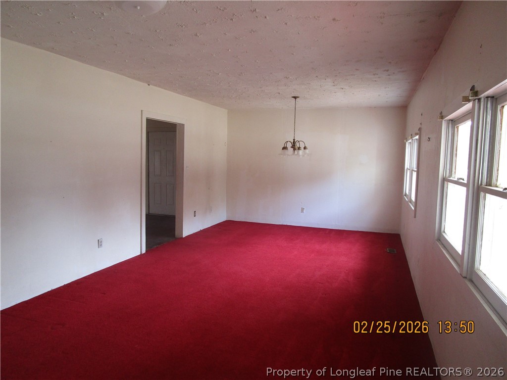 256 Chesters Road Roseboro, NC 28382 - Photo 6 of 22 a view of empty room with window