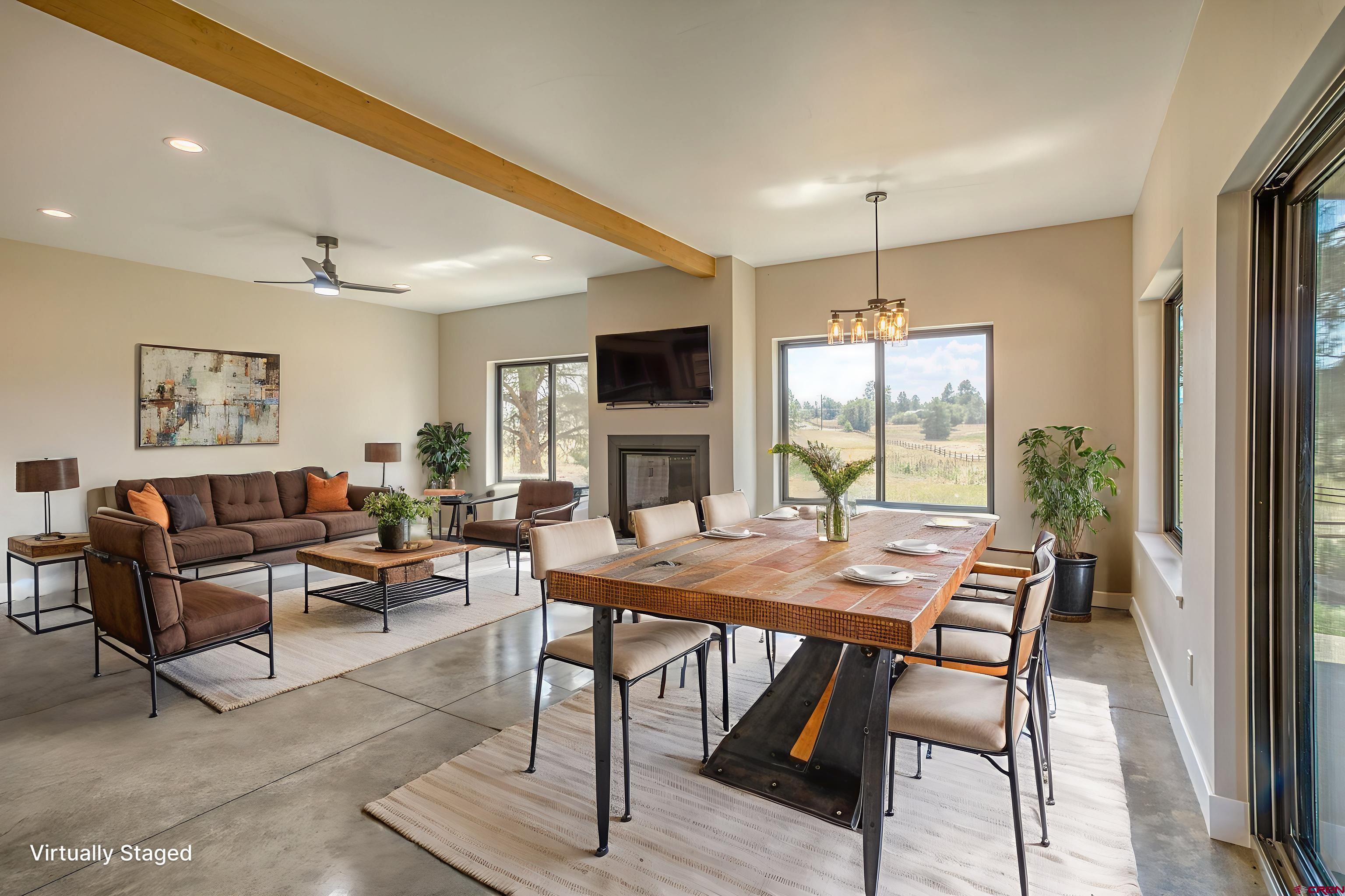 2790 Rock Road, Unit C Pagosa Springs, CO 81147 - Photo 11 of 44 a view of a dining room with furniture window and wooden floor