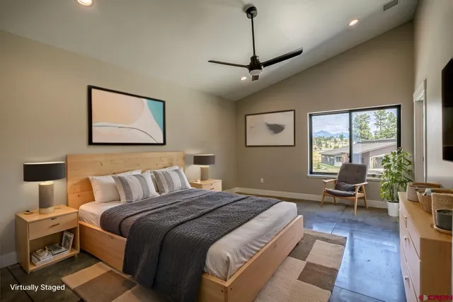 a bedroom with bed window and couch