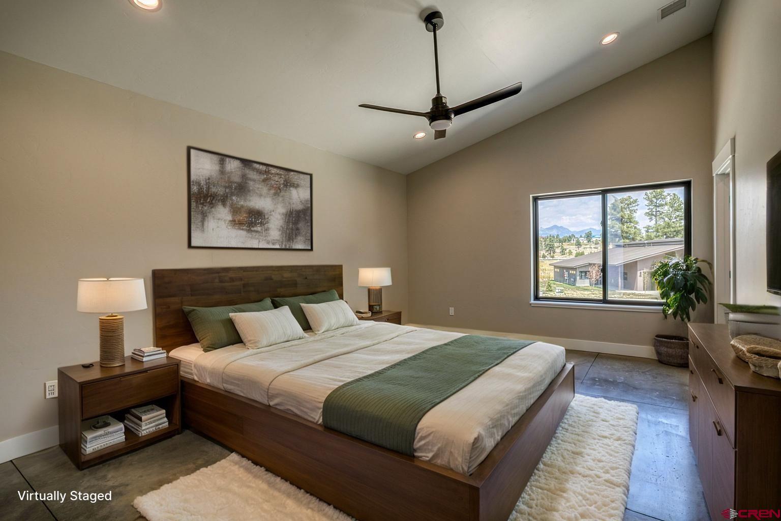 2790 Rock Road, Unit C Pagosa Springs, CO 81147 - Photo 15 of 44 a bedroom with bed window and couch