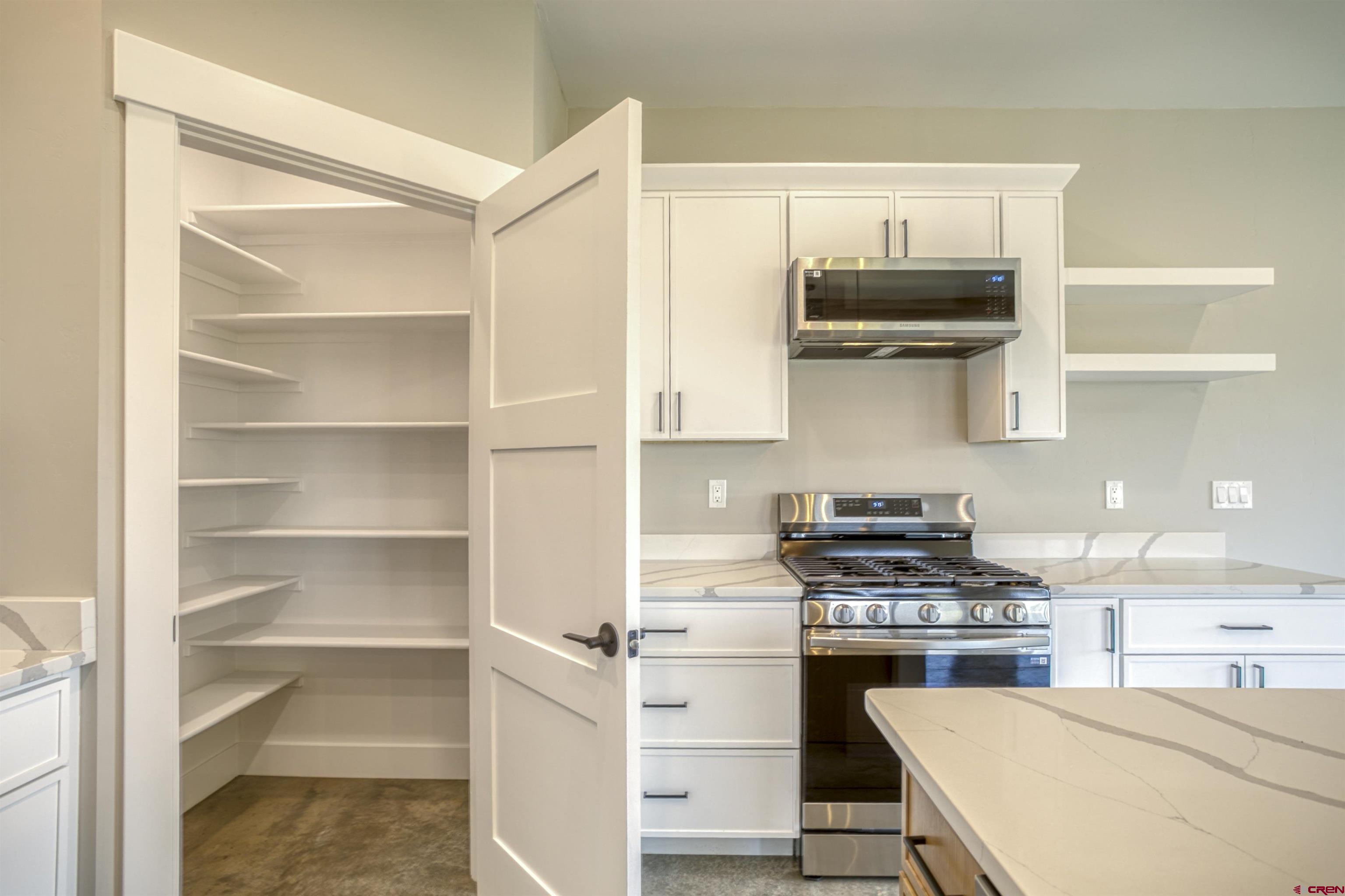 2790 Rock Road, Unit C Pagosa Springs, CO 81147 - Photo 22 of 44 a kitchen with a stove and a microwave