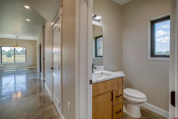 a large kitchen with kitchen island a sink stainless steel appliances and cabinets