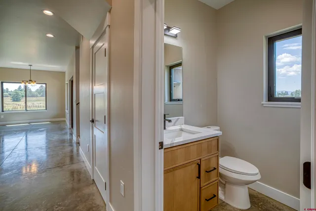 a large kitchen with kitchen island a sink stainless steel appliances and cabinets