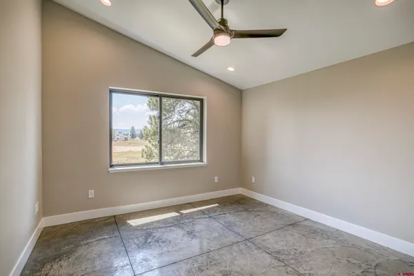 an empty room with closet area