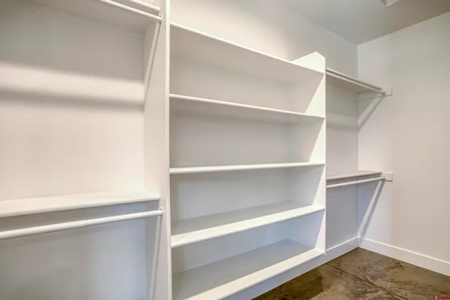 a view of an empty walk in closet