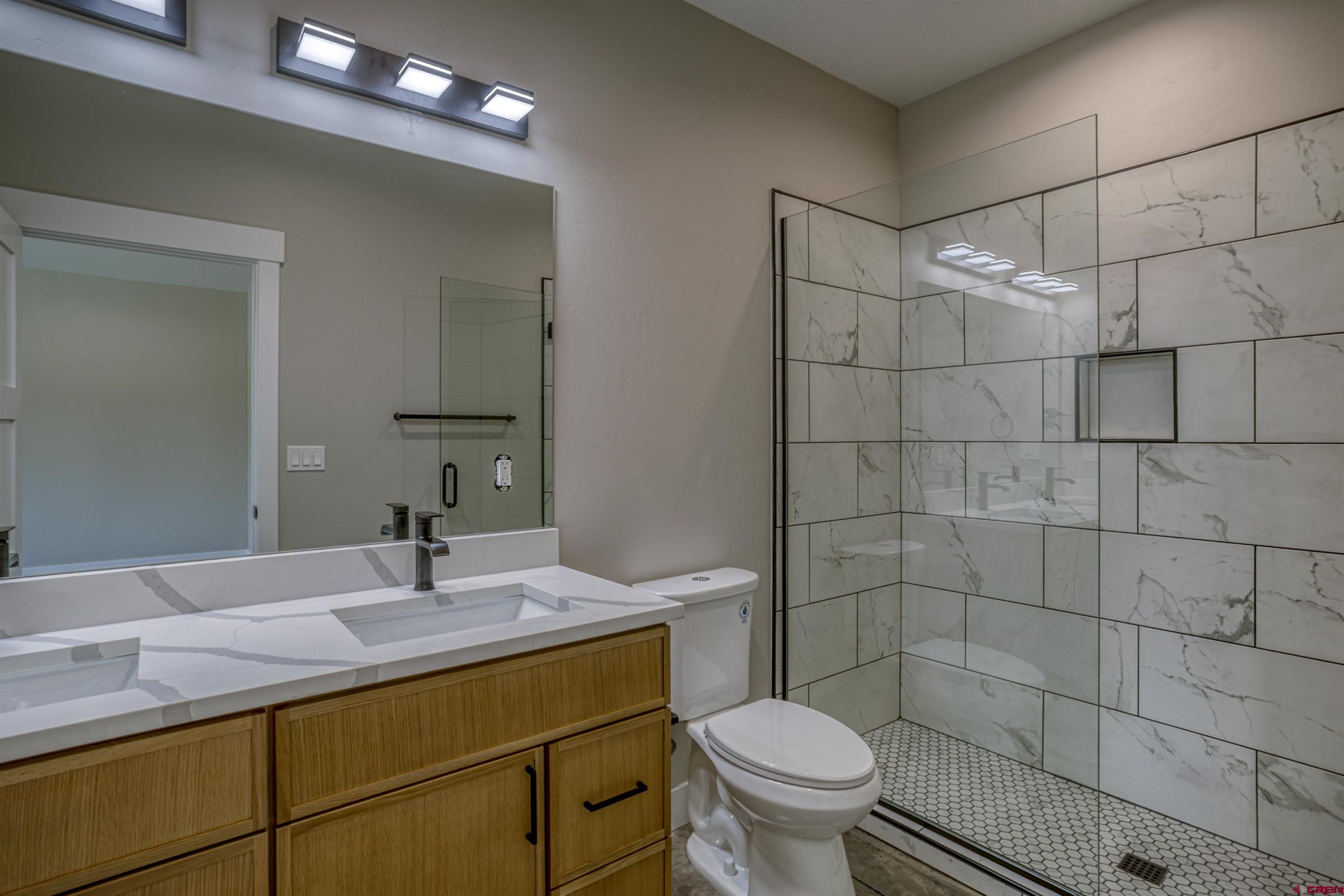 2790 Rock Road, Unit C Pagosa Springs, CO 81147 - Photo 44 of 44 a bathroom with a sink toilet and shower