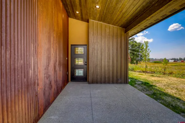 a view of a room with door and balcony