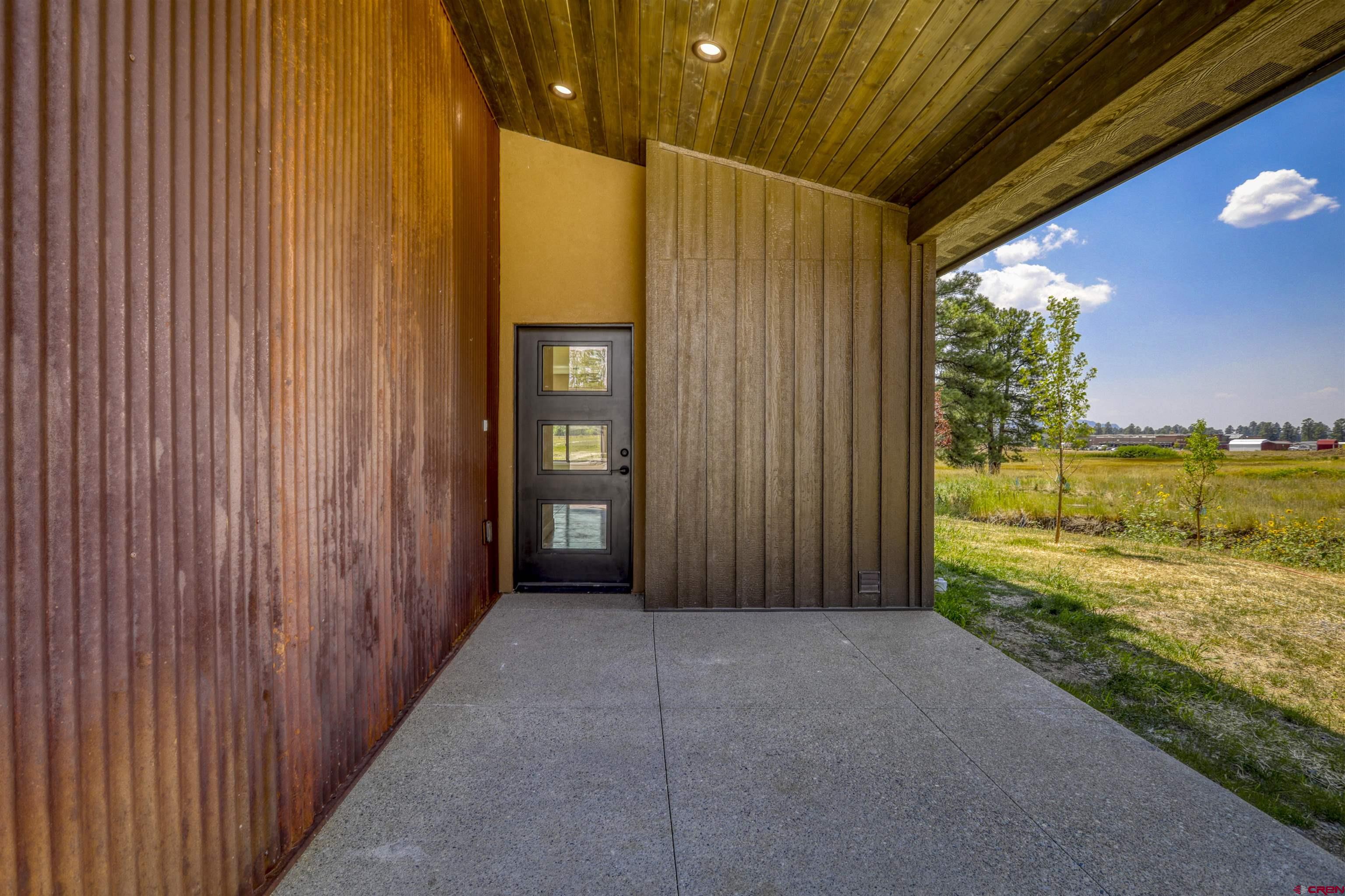 2790 Rock Road, Unit C Pagosa Springs, CO 81147 - Photo 5 of 44 a view of a room with door and balcony