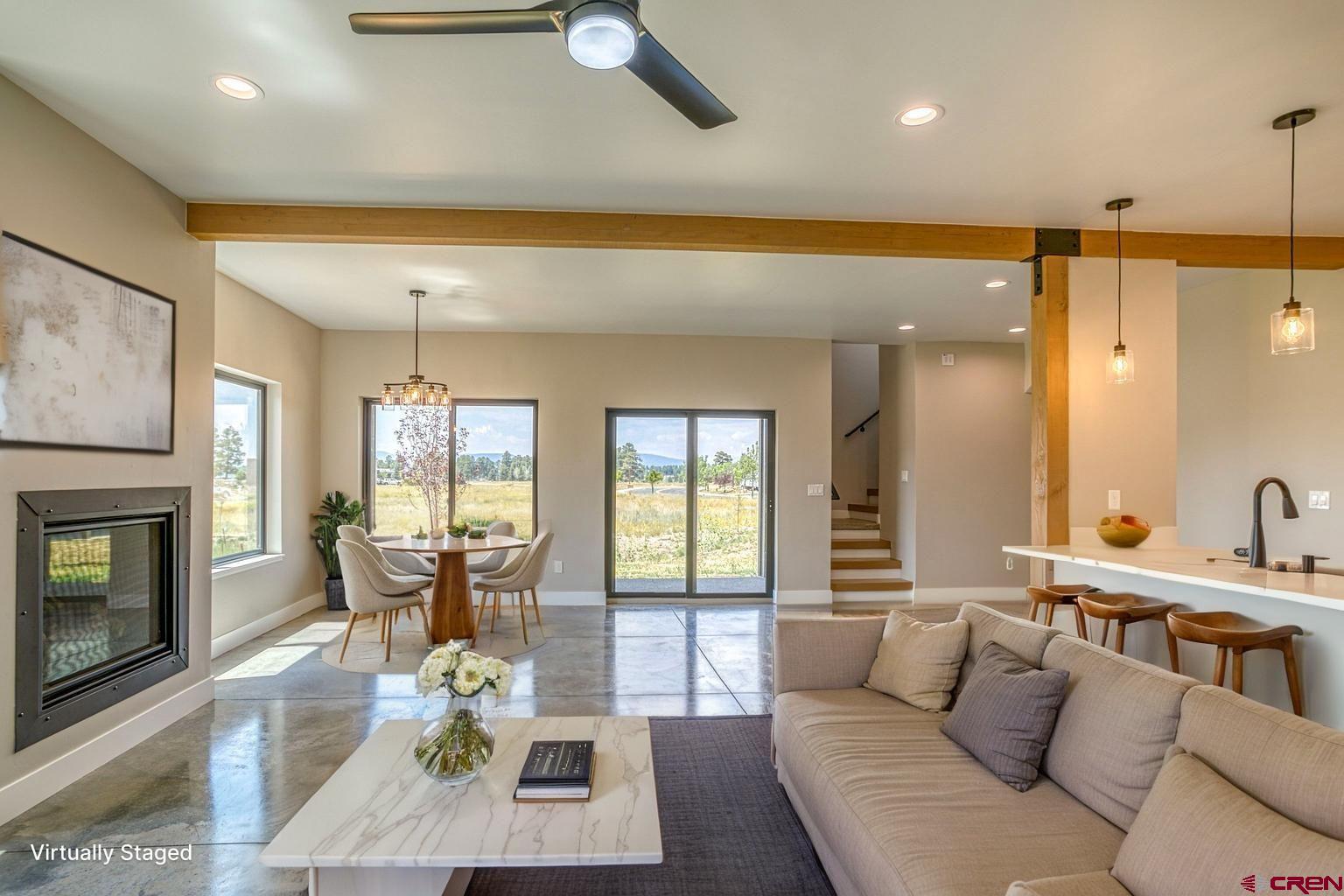 2790 Rock Road, Unit C Pagosa Springs, CO 81147 - Photo 7 of 44 a living room with furniture and a fireplace
