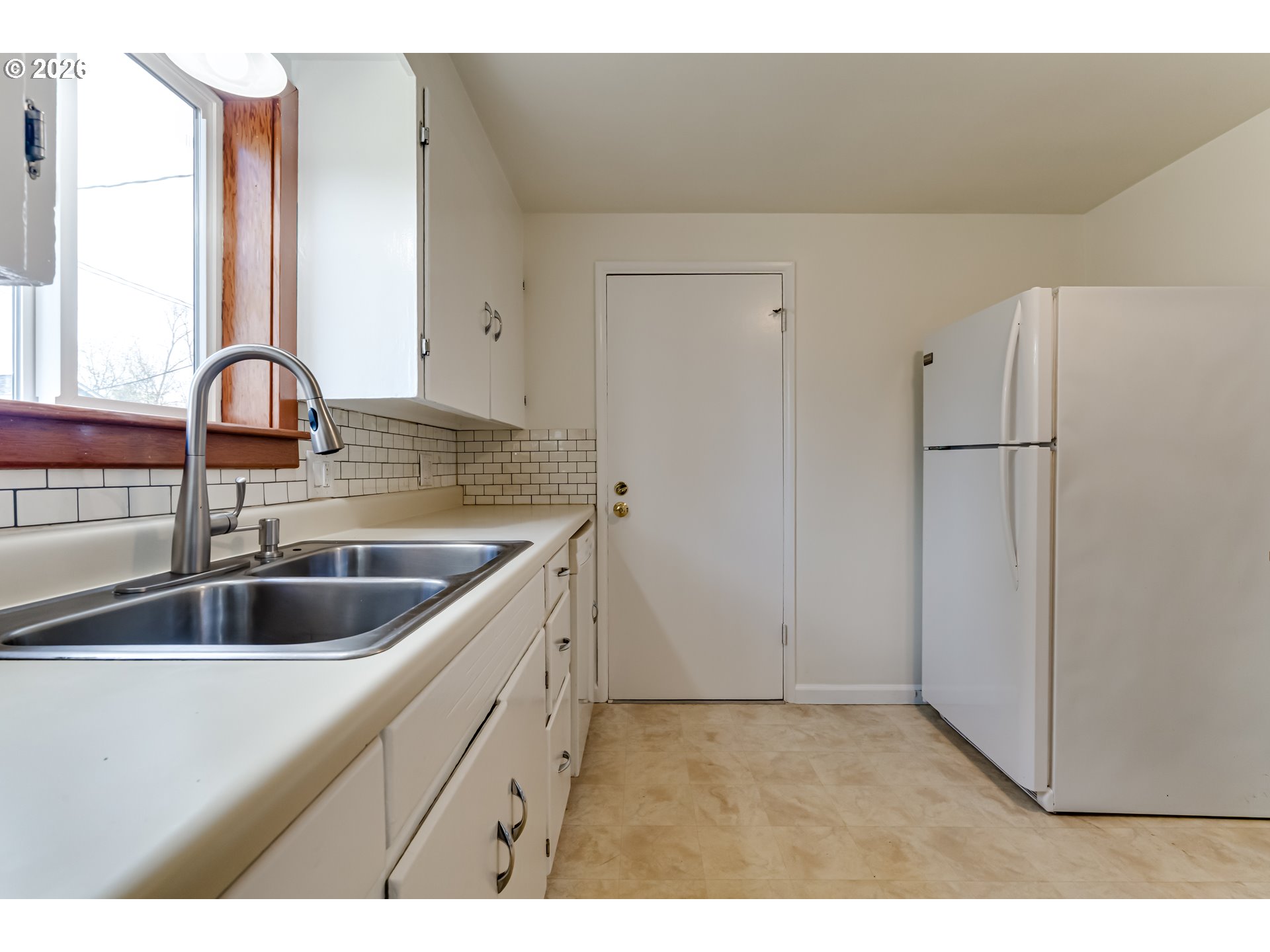 2125 West 19th Place Eugene, OR 97405 - Photo 19 of 29 a kitchen with a sink and cabinets