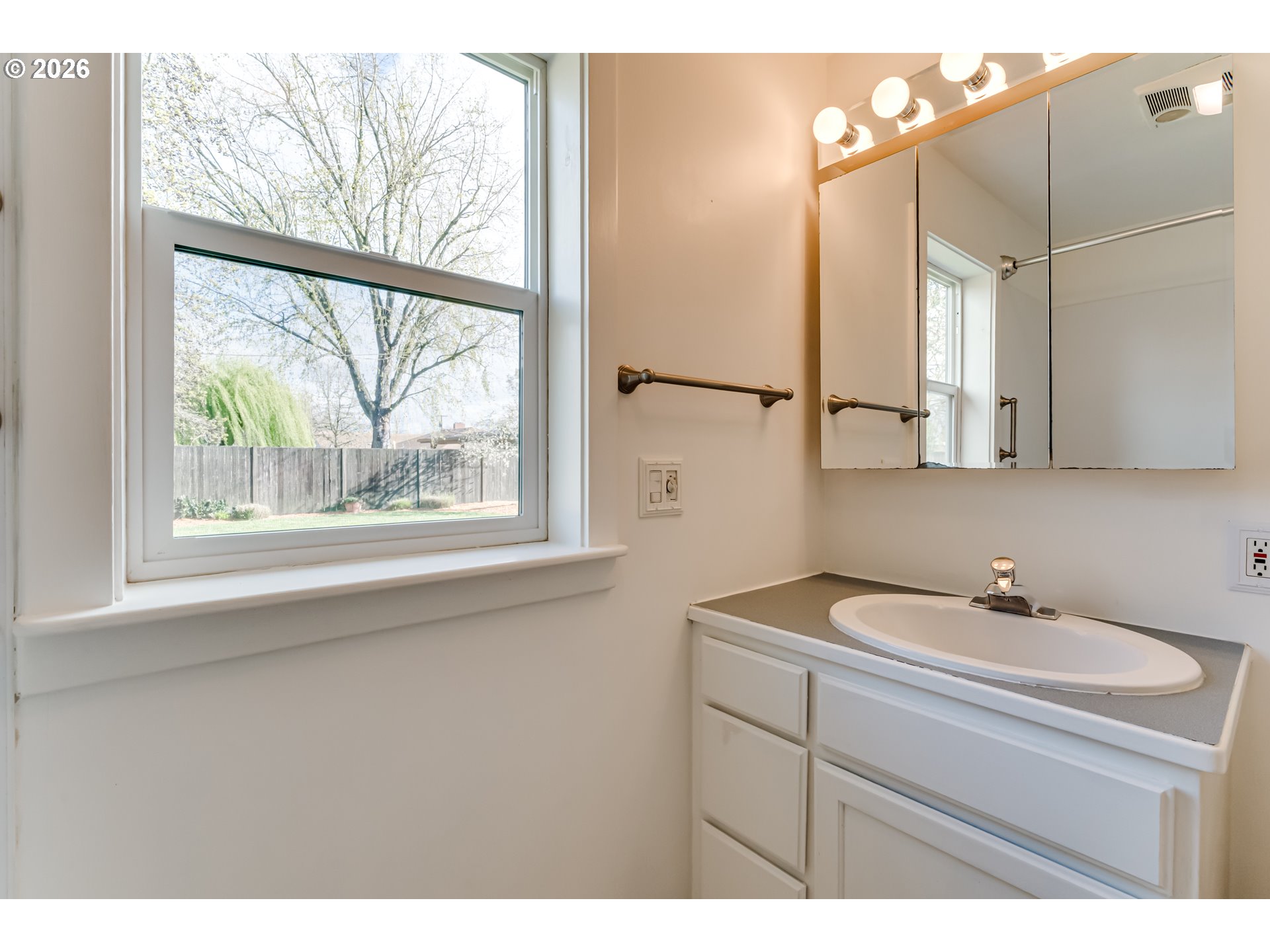 2125 West 19th Place Eugene, OR 97405 - Photo 22 of 29 a bathroom with a sink and a mirror