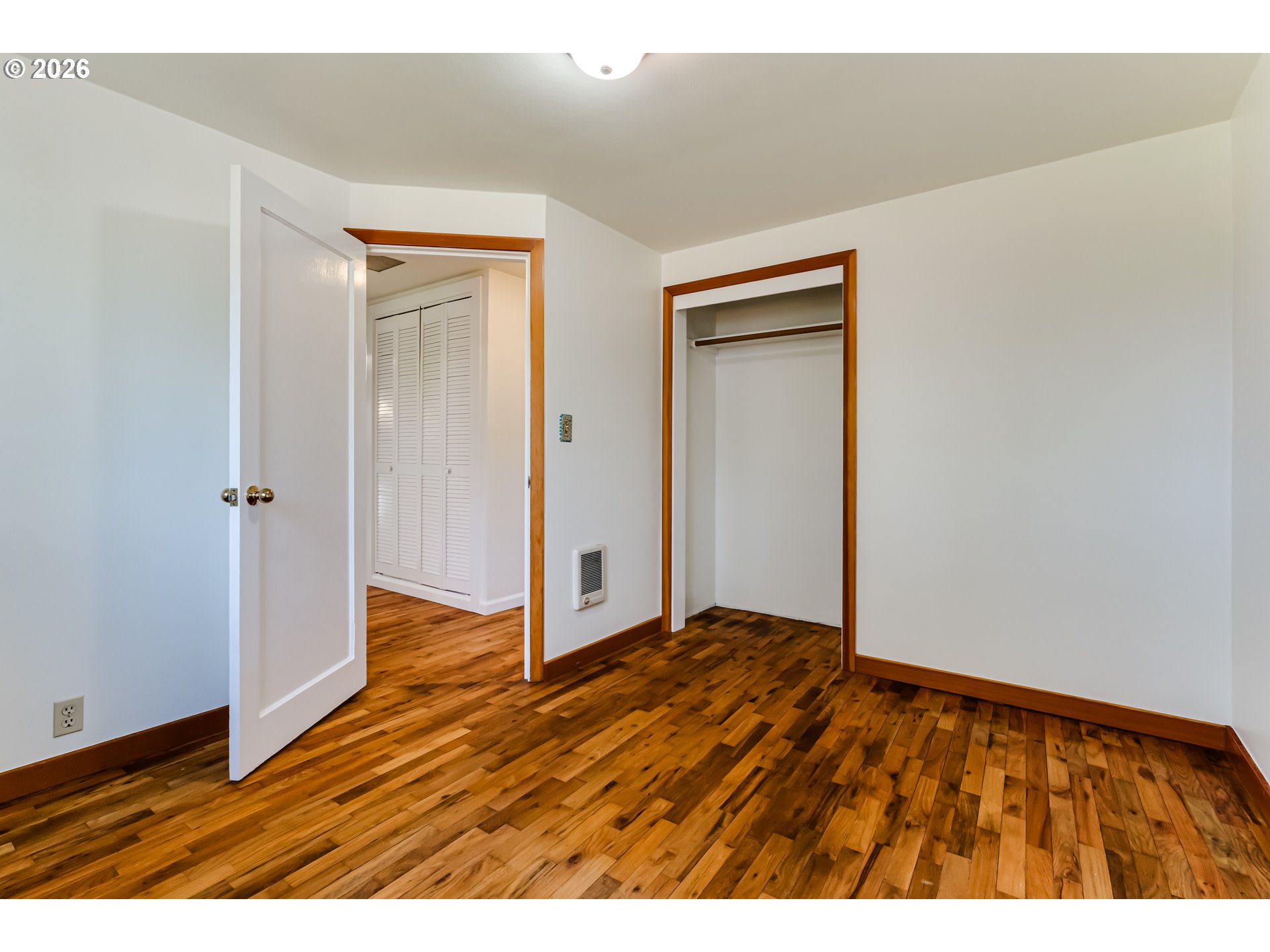 2125 West 19th Place Eugene, OR 97405 - Photo 24 of 29 a view of an empty room with wooden floor