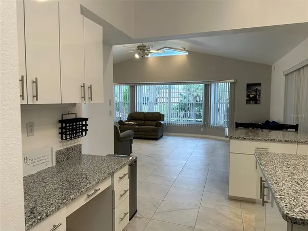 a kitchen with a sink and a counter top space